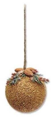 Decorative spherical ornament with natural elements on a white background