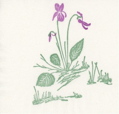 Linocut print of purple flowers with green leaves on a white background
