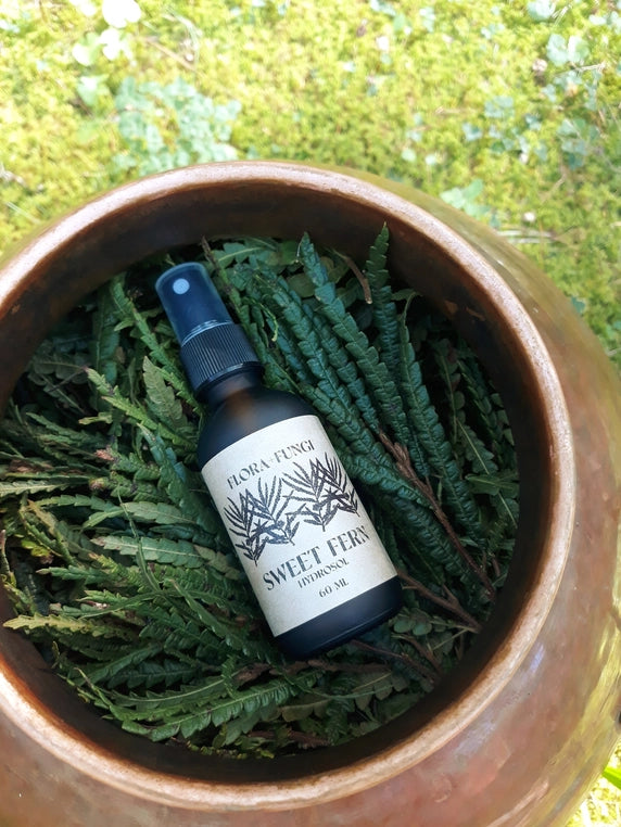Sweet Fern Hydrosol with leaves and copper bowl