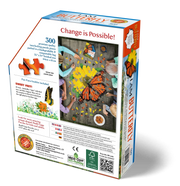 Jigsaw puzzle box with butterfly theme (back of box) showing scale of puzzle, sample piece, and packaging.