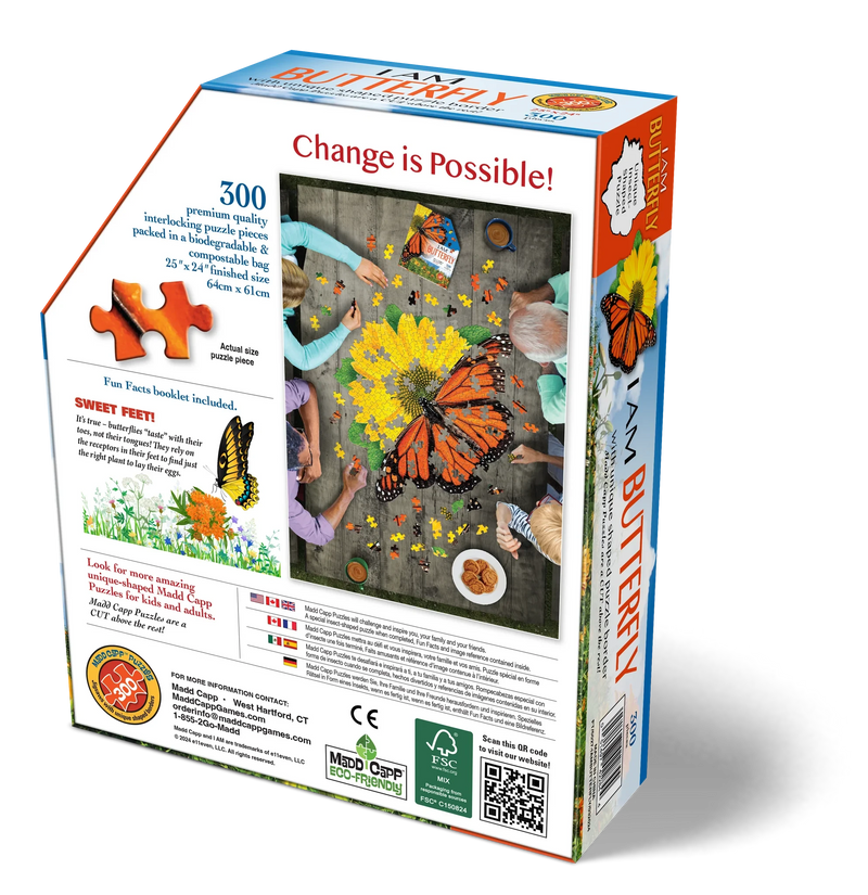 Jigsaw puzzle box with butterfly theme (back of box) showing scale of puzzle, sample piece, and packaging.