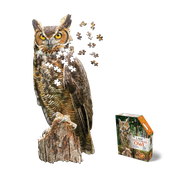 Partially assembled jigsaw puzzle featuring Great Horned Owl 