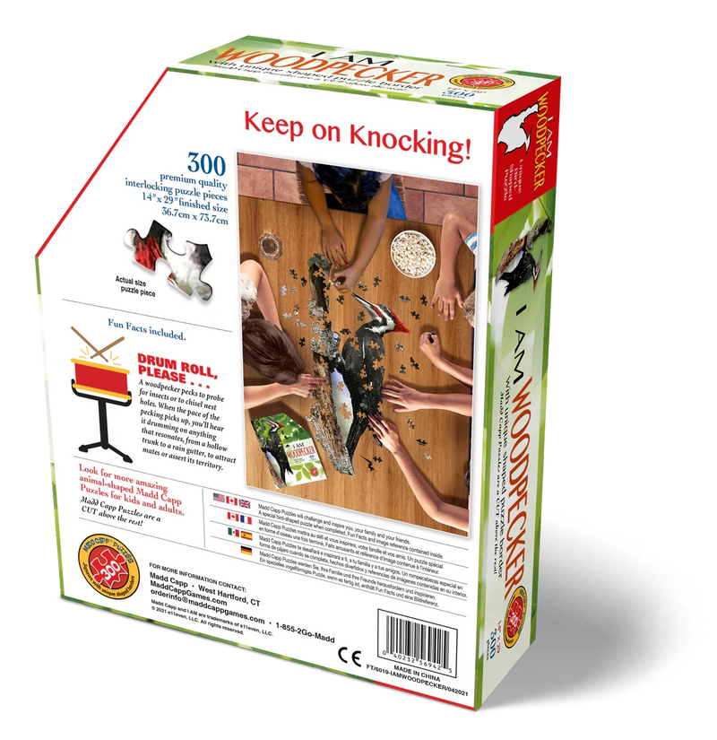 Puzzle box with 'Keep on Knocking!' text and images of family assembling a woodpecker puzzle.