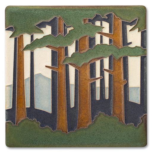 Decorative tile with a forest design featuring trees and mountains.