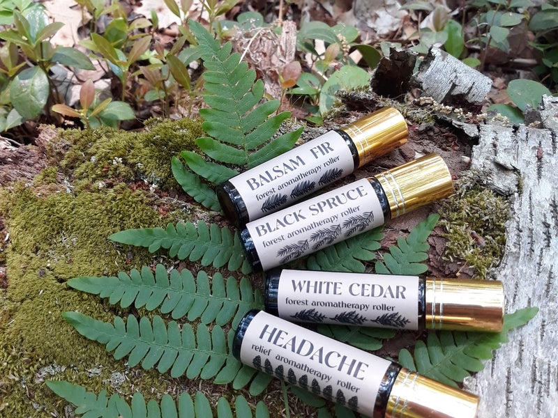 Headache Rescue Oil Roller shown with other aromatherapy oils