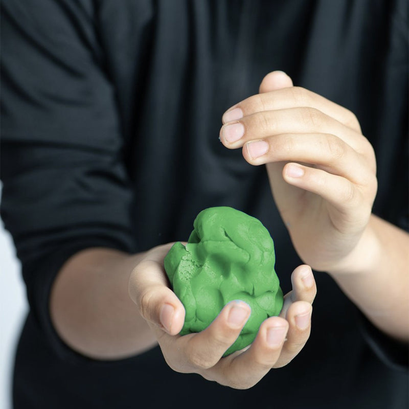 Person holding a green ball of eco dough 