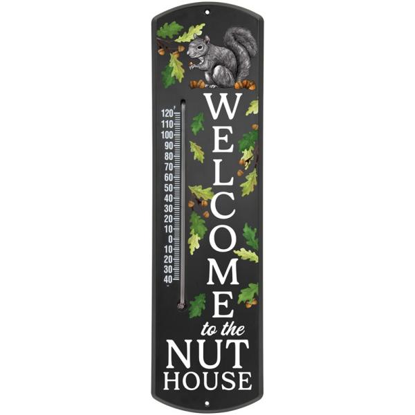 Nut house thermometer with black background and white text that rats: "welcome to the nut house" featuring a grey squirrel, acorns and oak leaves. 