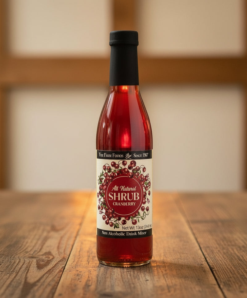 Bottle of cranberry shrub with a black cap 