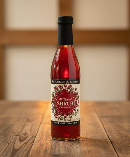 Bottle of cranberry shrub with a black cap 