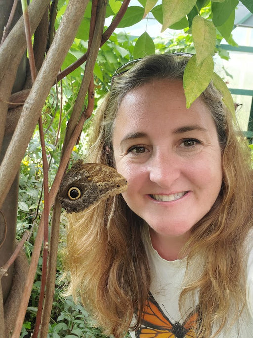 Entomologist Elly Maxwell with a butterfly