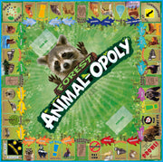 Board game titled 'Forest Animal-opoly' with a raccoon illustration on a green background.