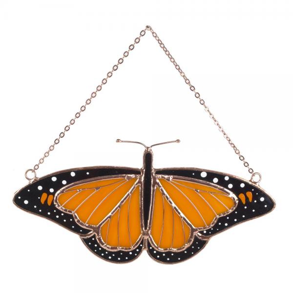 bright orange monarch butterfly with the black and white speckles with copper electroplate details