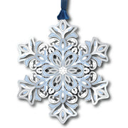 Decorative snowflake ornament with intricate patterns on a white background