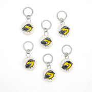 Set of six goldfinch-themed ceramic stitch markers on a white background