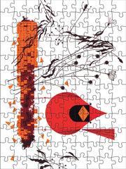 Jigsaw puzzle with abstract design featuring a red cardinal and corncob on a white background