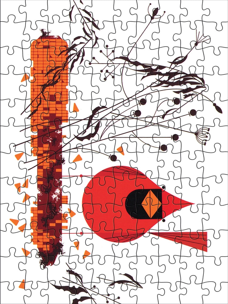 Jigsaw puzzle with abstract design featuring a red cardinal and corncob on a white background
