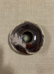 Brown ceramic bowl with oak leaf and the flower frog inside