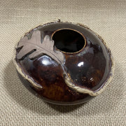 Brown ceramic pillow vase details