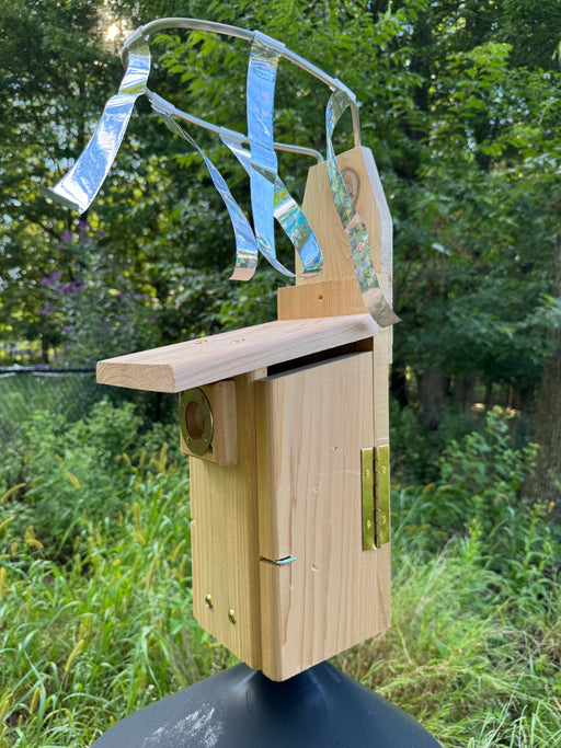 Side view of Sparrow Chaser installed on an Ultimate Bluebird House