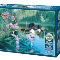 Puzzle box with a scenic design of loons on a pond with iris and butterflies.