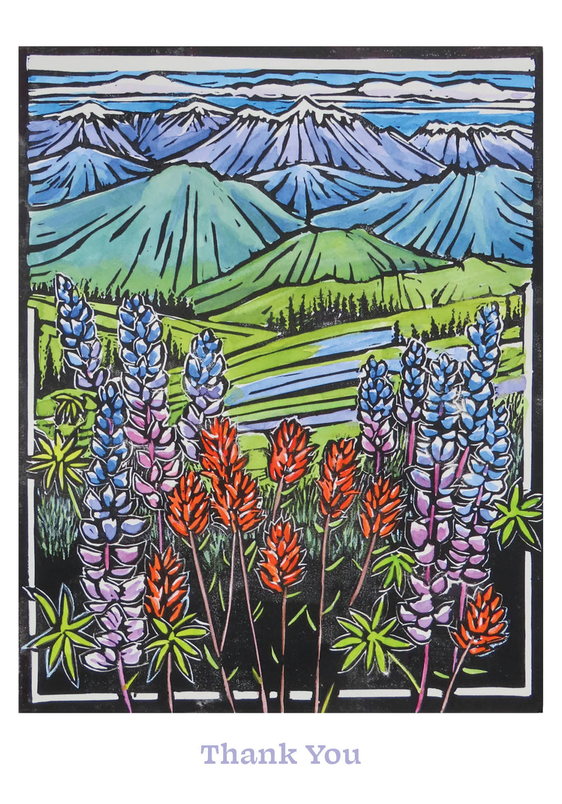 Card with colorful lupine flowers and mountain landscape, featuring the text 'Thank You'. Artist Molly Hashimoto.