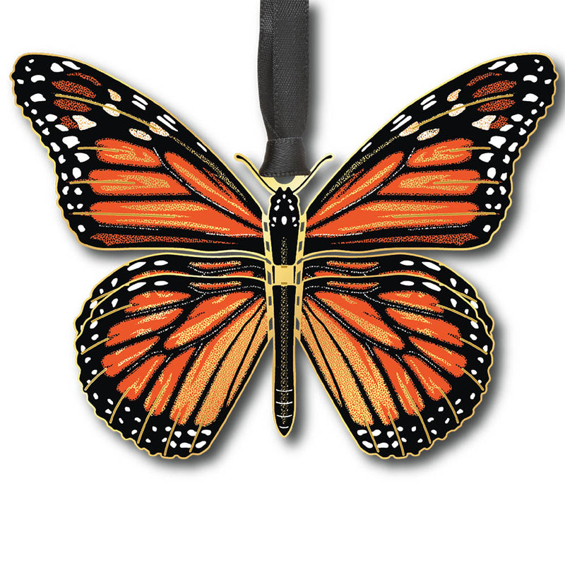 Butterfly-shaped ornament with orange and black wings on a white background