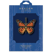 Monarch Butterfly ornament in blue Beacon Design packaging on a white background