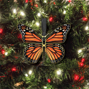 Monarch Butterfly ornament on a decorated holiday tree with lights 