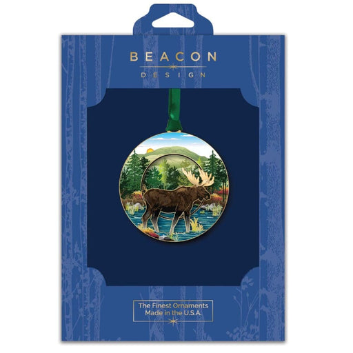 Moose design Christmas ornament in Beacon Design packaging on a blue background