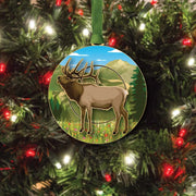 Decorative ornament with a mountain elk design on a Christmas tree.