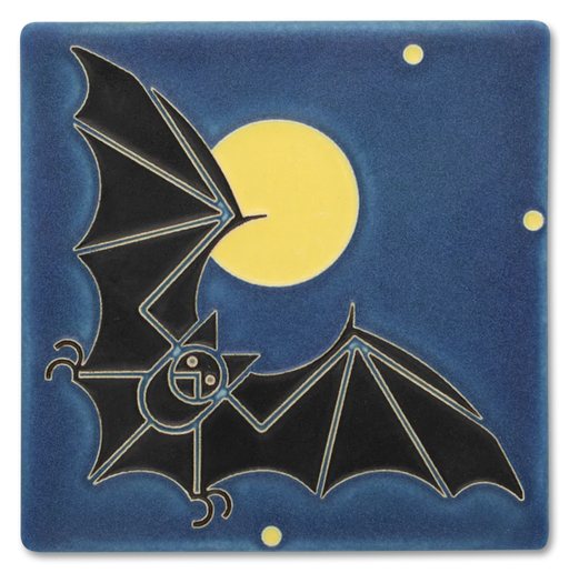 Decorative tile with black bat design against a deep blue background with a full yellow moon.