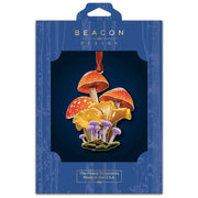 Mushroom ornament with Beacon Design branding on a blue background