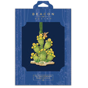 Prickly Pear Cactus ornament in Beacon Design packaging with a  blue background