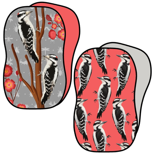 Two kitchen sponges with woodpecker design.