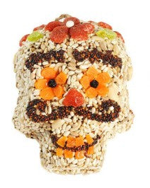 Decorative skull-shaped treat with orange flowers on a white background - mustache