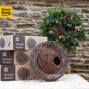Simon King Wreath Nester - with decorated wreath in the background