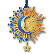 Decorative ornament with sun, moon, and stars on a white background