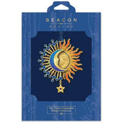 Sun and moon ornament design in blue Beacon Design packaging.
