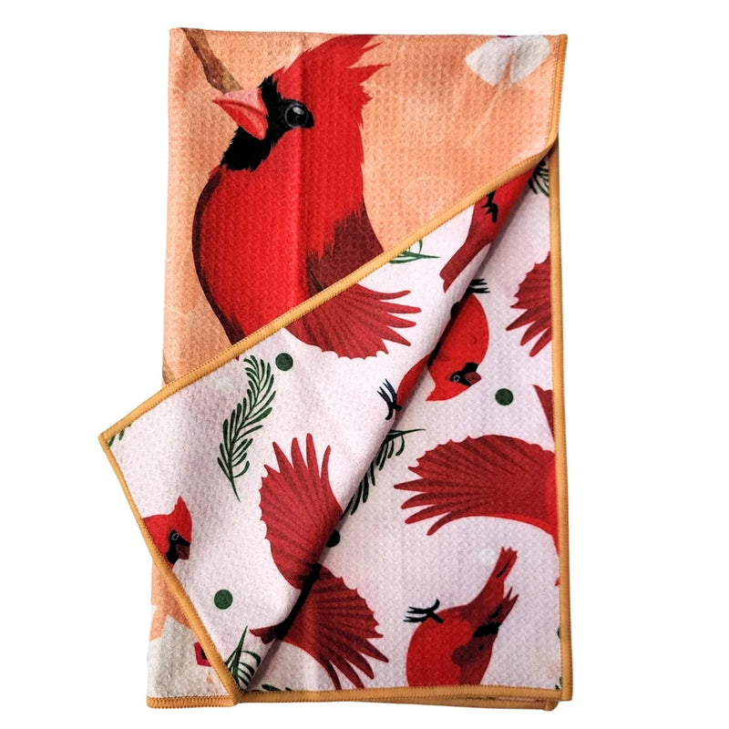 Folded towel with reversible pattern - red cardinal bird patterns