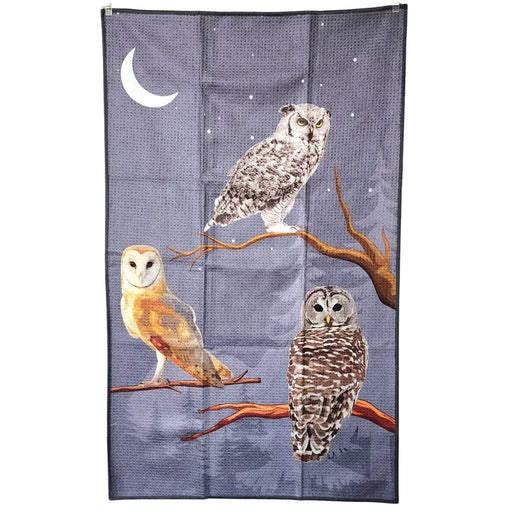 Tea towel with original artwork depicting three owls on branches against a night sky with a moon.