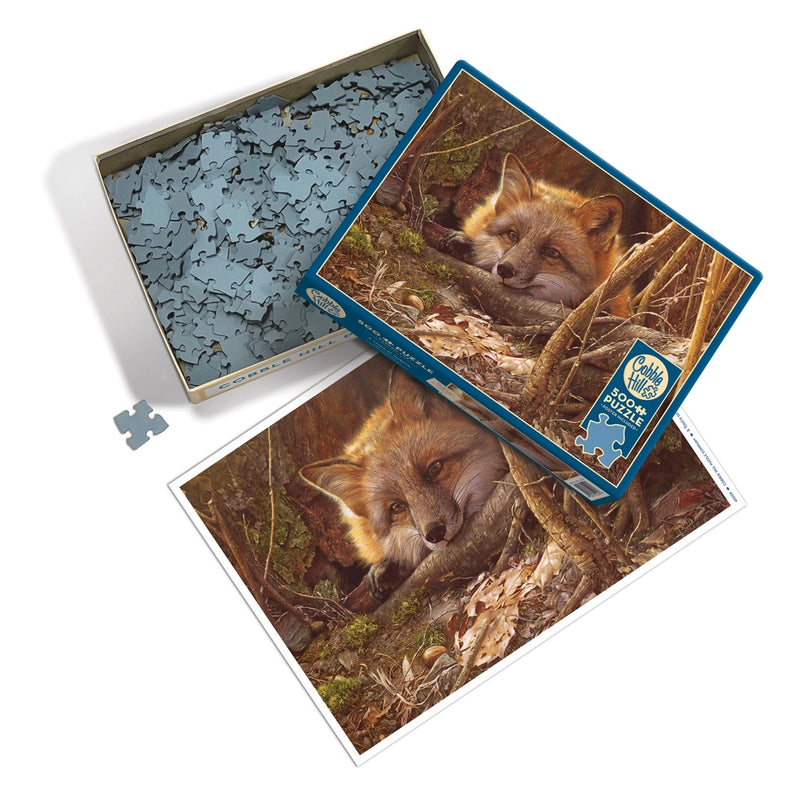 Jigsaw puzzle with original artwork of a fox resting in a forest.  Sample puzzle pieces shown.
