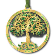 Decorative tree ornament with green leaves and gold trunk on white  background.