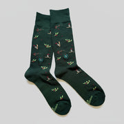 green crew socks featuring woodpeckers and berries 