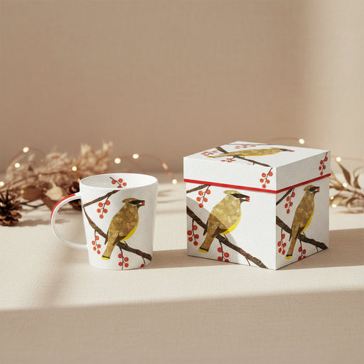 white mug with cedar waxwing perched on branch surrounded by and eating a red berry. bird has patterned design background has gray polka dot design 
