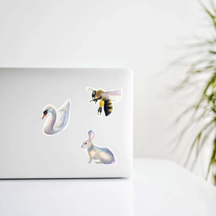 Bee Vinyl Sticker in use on a laptop cover