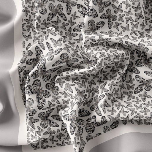 silk scarf with black butterflies on a white silk background