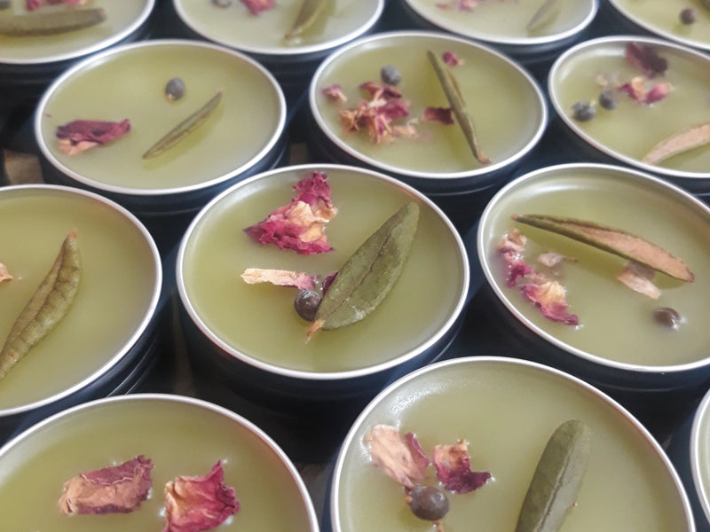 Boreal botanical balms shown closeup with lids off