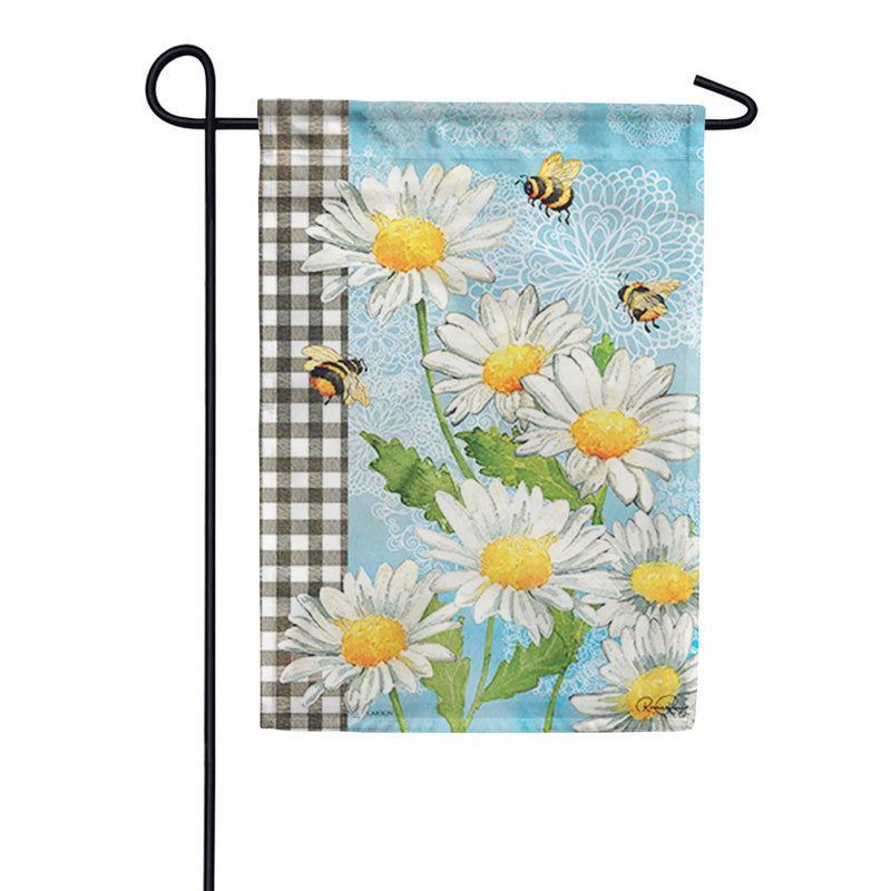 Decorative garden flag with daisies and bees on a blue background, displayed on a stand. (stand not included in purchase of this flag)