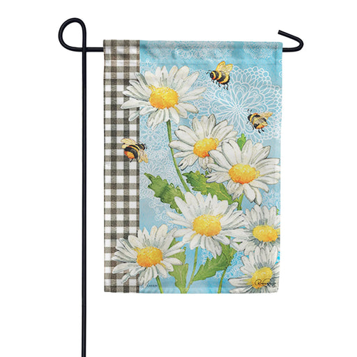 Decorative garden flag with daisies and bees on a blue background, displayed on a stand. (stand not included in purchase of this flag)