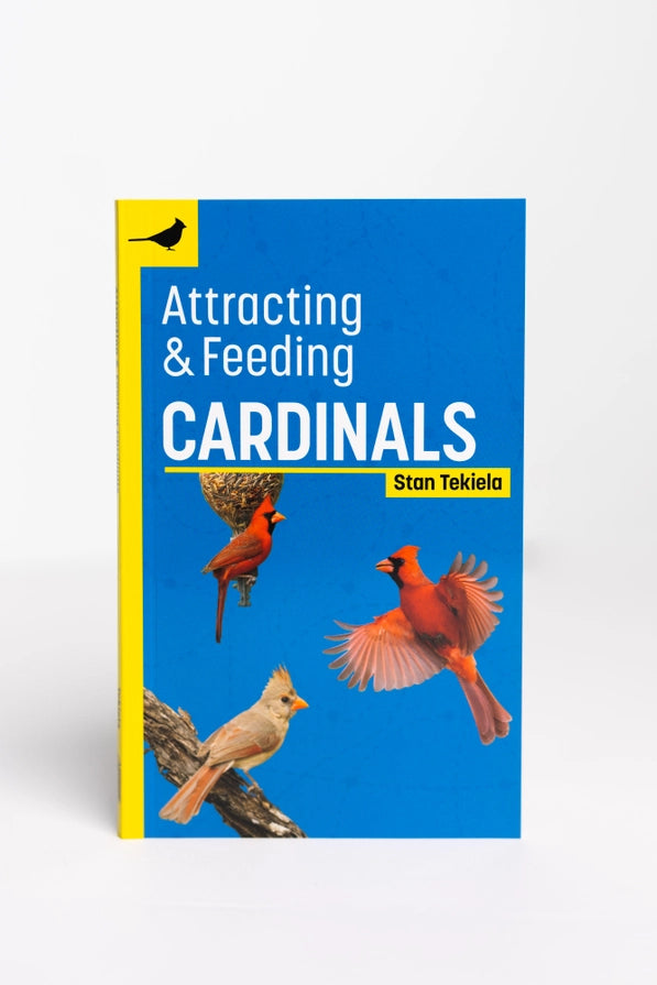 Book cover of 'Attracting & Feeding Cardinals' by Stan Tekiela with images of cardinals on a blue background.